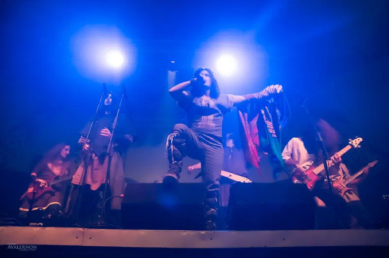 Kanseil on stage under blue lights