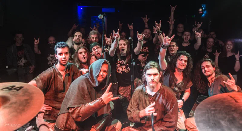 The band posing with the audience after a show